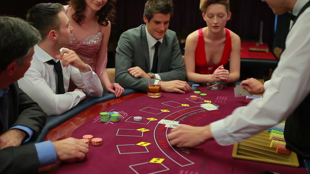 People playing blakcjack at the casino