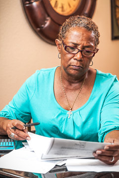 Woman Analyzing Bill