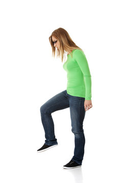Student woman trying to trample something