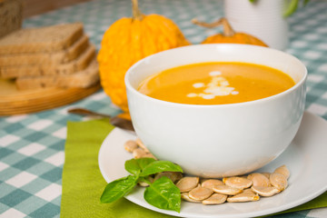 Pumpkin soup in a white plate