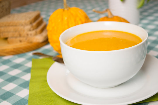 Pumpkin soup in a white plate
