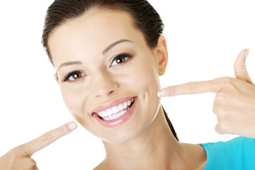 Woman showing her perfect  teeth.