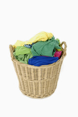 pile of colorful shirts in a wicker basket,
