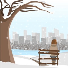 Girl sit on a bench winter park snow