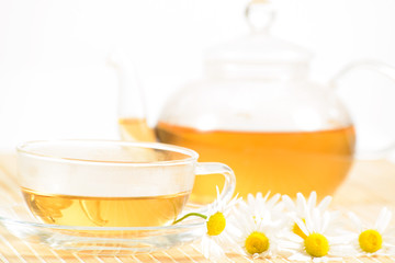 teacup with herbal chamomile tea