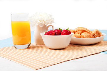 Breakfast with berries,orange juice and croissant