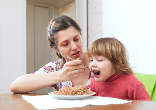 Mother Feeding Her 2 Years Child