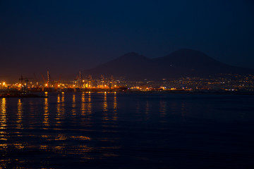 harbor of naples with vesuvius at night