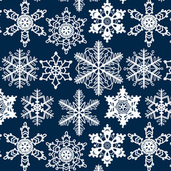 Crochet snowflakes seamless pattern on dark blue, vector