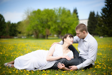 Girl and boy lying on the grass