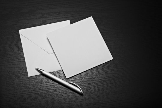 White Blank Square Envelope Letter On Dark Desk