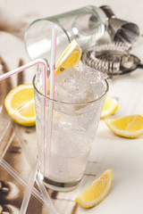 Refreshing clear, lemon drink and ice