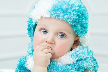 Cute baby at winter background