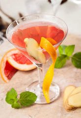 Red drink with grapefruit and ginger