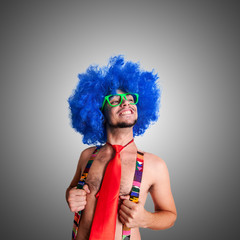 Funny guy naked with blue wig and red tie