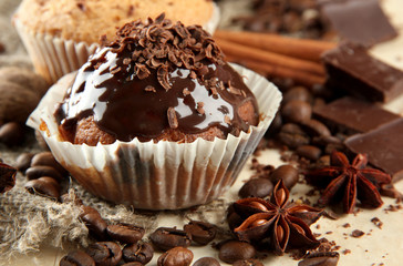 tasty muffin cakes with chocolate, spices and coffee seeds,