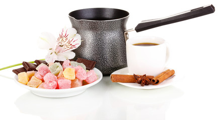 White cup of Turkish coffee with rahat delight and coffee pot