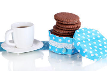 Chocolate cookies with creamy layer and cup of coffe