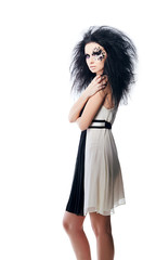 Woman in black and white dress with black hair and art make up