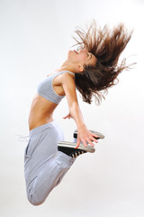 attractive girl jumping in studio