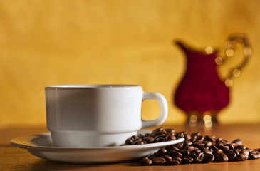 White cup of coffee and saucer still life