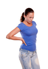 Young woman standing with back pain