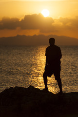 Silhouette of a person against sunset