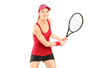 A female tennis player holding a racket