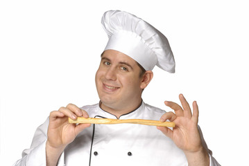 Un cocinero,chef probando pan.palillo de pan.
