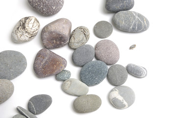 Fototapeta na wymiar colorful pebble stone on white