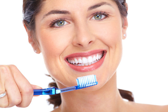 Happy woman with a toothbrush. Dental care.