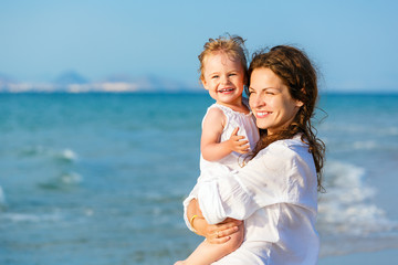 Mother and daughter on the beach