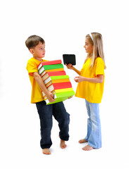 Boy carrying heavy books, girl shows him an e-book