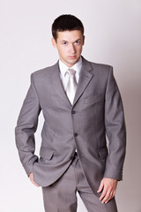 Fototapeta premium portrait handsome man in grey suit