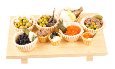 Various snacks in plate on banquet table