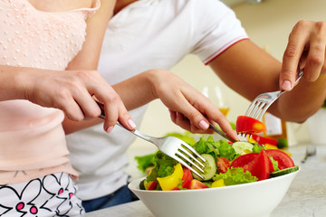 Mixing salad ingredients