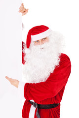 Santa Claus pointing at banner isolated on white background