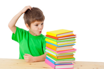 Boy with books scratching his head