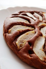 Chocolate cake with sliced pears on the top