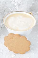 ginger biscuits, cup of cappuccino, Christmas tinsel