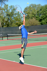 Mature tennis player during a match
