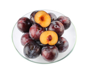 Plums in a glass plate