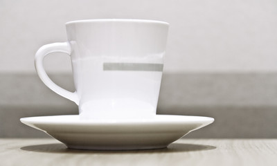 Obraz na płótnie Canvas coffee cup against striped background