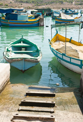 Fototapeta na wymiar Colorful traditional fishing boats in the island of Malta