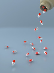 Pills spilling from an open bottle