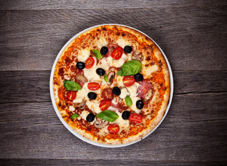 Delicious italian pizza served on wooden table - obrazy, fototapety, plakaty