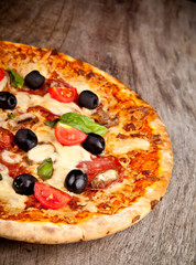 Delicious italian pizza served on wooden table