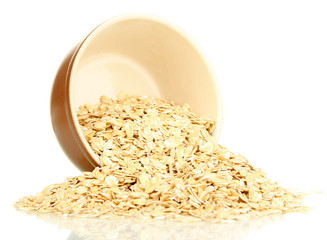 Oat flakes in brown bowl isolated on white