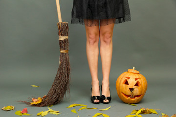 Halloween background with pretty female legs