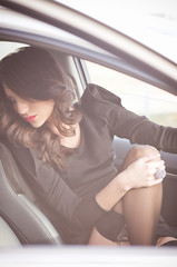 Beautiful lady sitting in a car